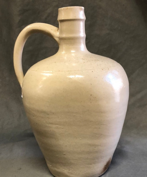 HAND THROWN WHITE POTTERY JUG WITH FLAT SIDES AND HANDLE