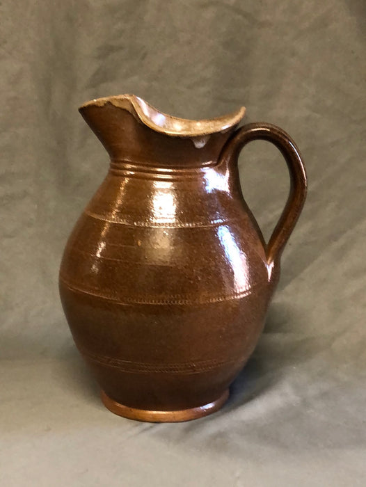 SMALL BROWN BULBOUS BASE HAND THROWN POTTERY PITCHER