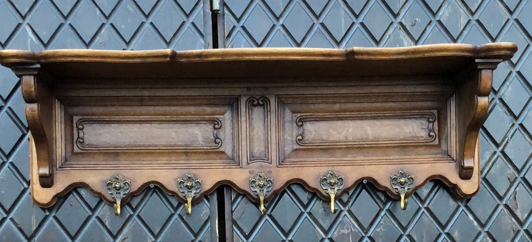 PANELED OAK WALL SHELF WITH GENTLEMAN ON HOOKS