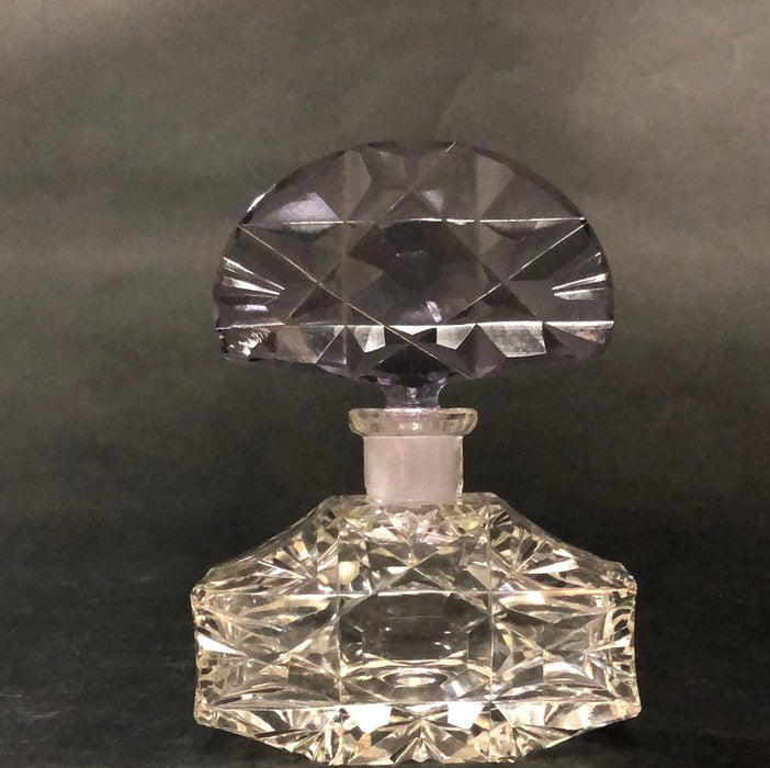 CLEAR PERFUME BOTTLE WITH PURPLE TOP