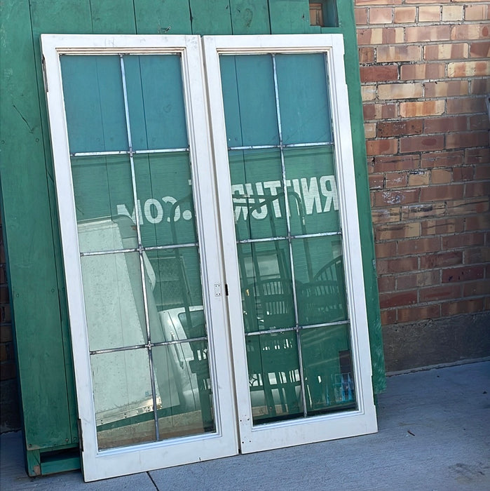 PAIR OF VERTICAL NARROW LEADED GLASS WINDOWS WITH RECTANGULAR PANES