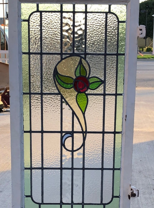 TALL STAINED GLASS WINDOW WITH RED ROSE AND GREEN BORDER