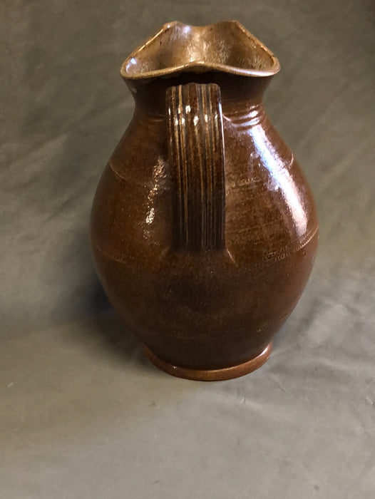 SMALL BROWN BULBOUS BASE HAND THROWN POTTERY PITCHER