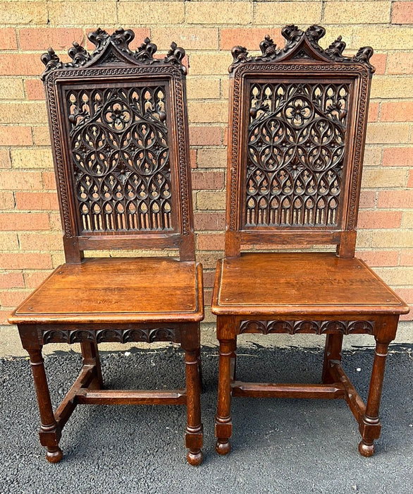 PAIR OF GOTHIC OAK HALL CHAIRS