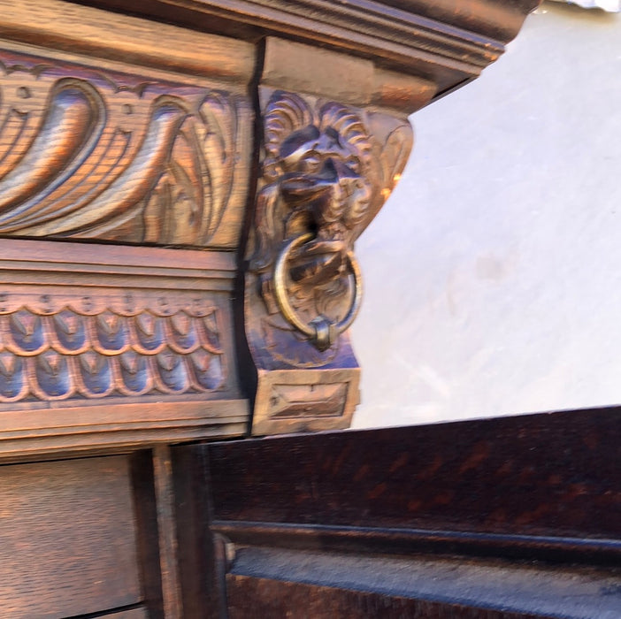 CARVED 2-PIECE OAK BRUEGHEL CABINET WITH FITTED INTERIOR