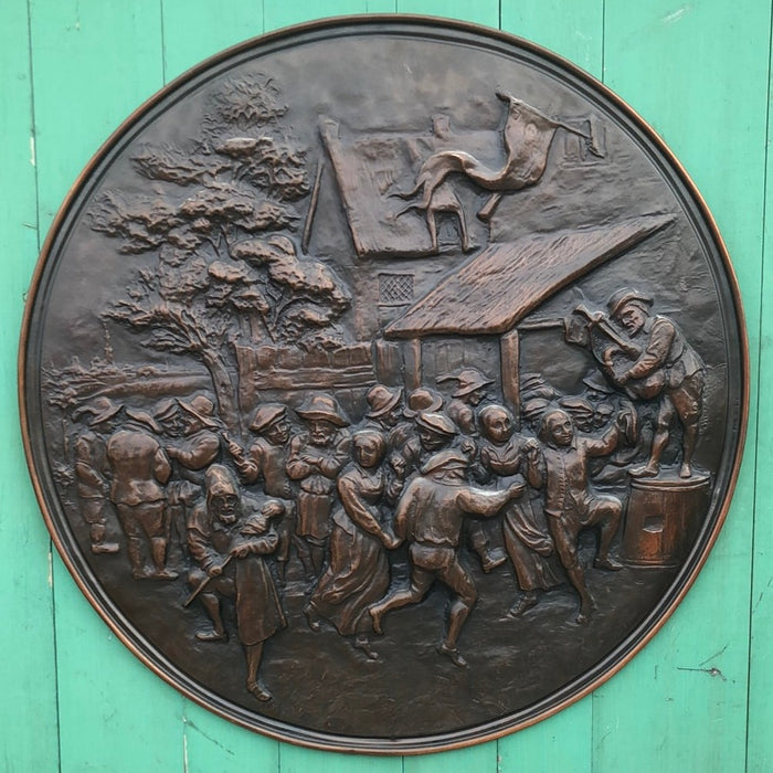 LARGE COPPER RELIEF PLAQUE.  With village people partying