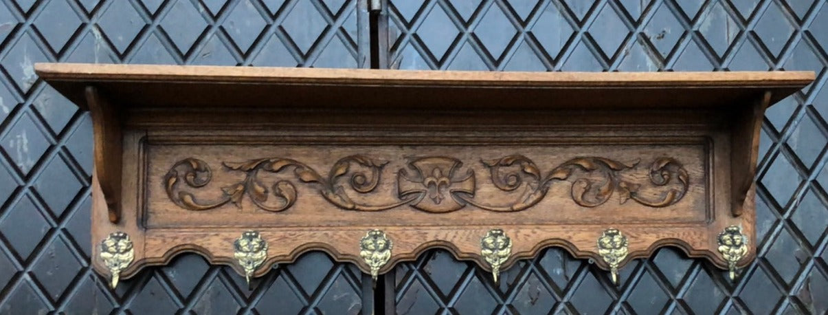 FOLIATE CARVED OAK WALL SHELF WITH HOOKS AND FLEUR DE LIS