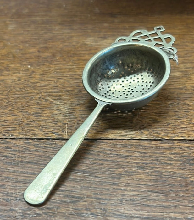 SILVERPLATE TEA STRAINER WITH HANDLE (AND HALLMARK)