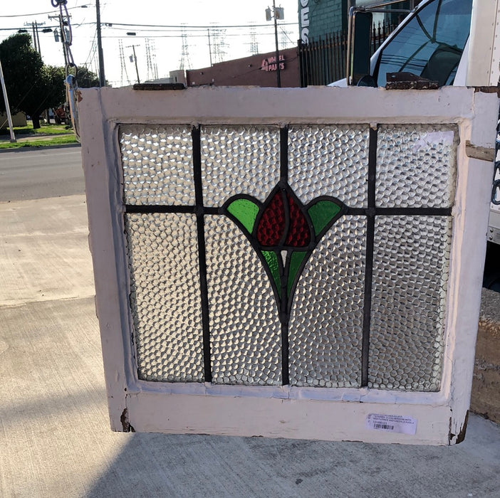 STAINED GLASS WINDOW WITH RED FLOWER AND GREEN LEAVES