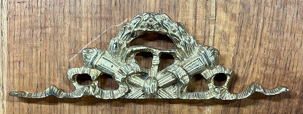 BRASS WALL HANGING WITH TORCHES AND WREATH