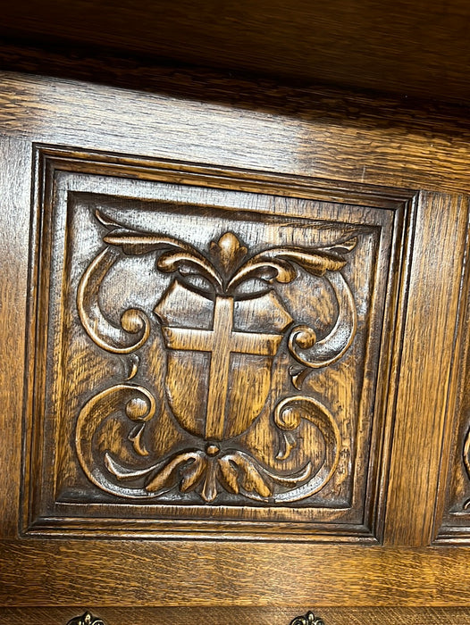 OAK CROSS AND FIGURAL CARVING WALL SHELF WITH HOOKS