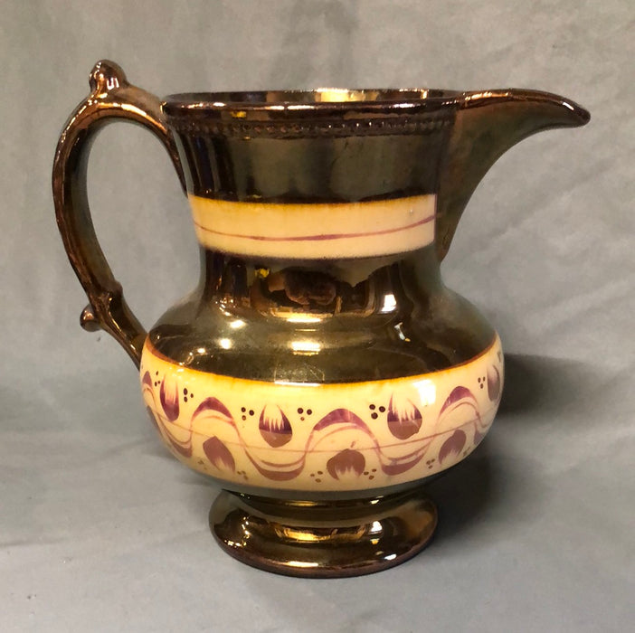 COPPER LUSTER PITCHER WITH 2 ORANGE BANDS AND TULIPS