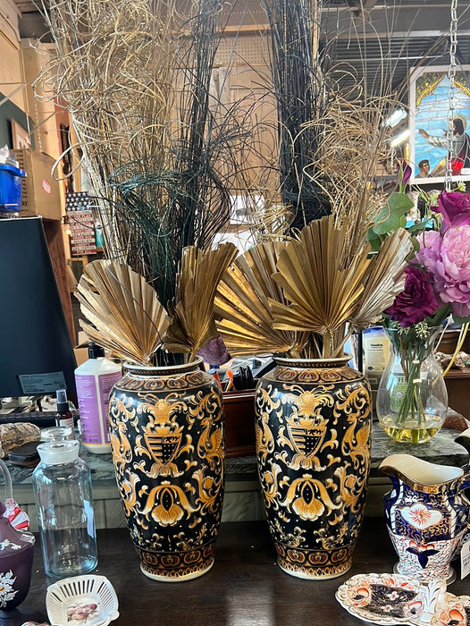 PAIR OF BLACK AND GOLD VASES WITH GLITTERY FANS AND STICKS ARRANGEMENTS