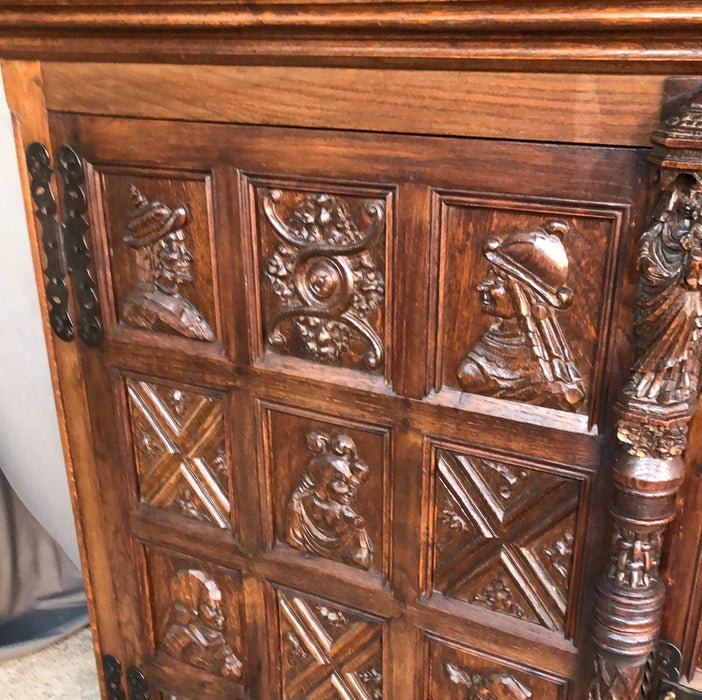 2 DOOR SHALLOW CARVED OAK GOTHIC CABINET with portraits