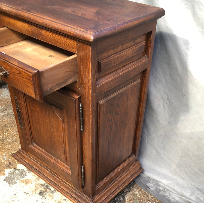 NARROW DARK OAK JAM CABINET WITH NOTCHED RETANGULAR PANEL