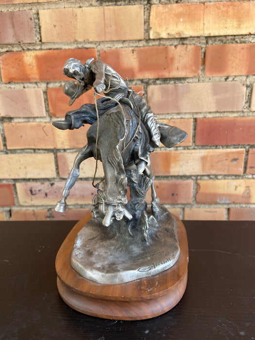 AS FOUND PEWTER COWBOY ON BRONCO STATUE