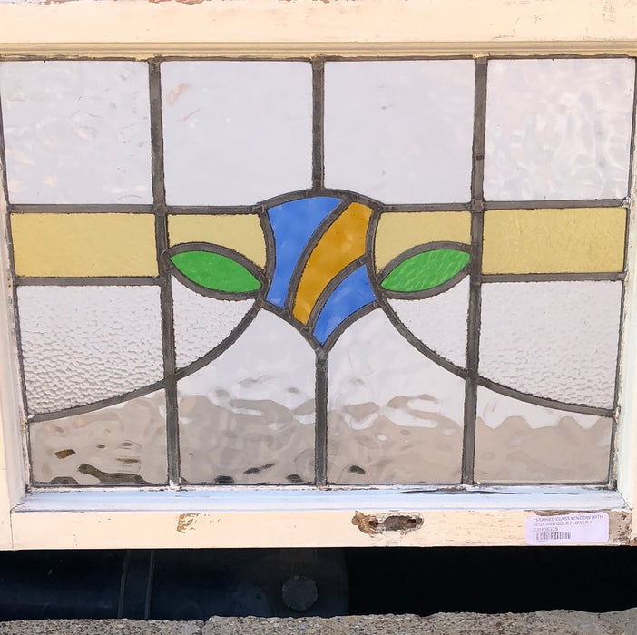 STAINED GLASS WINDOW WITH BLUE AND GOLD FLOWER