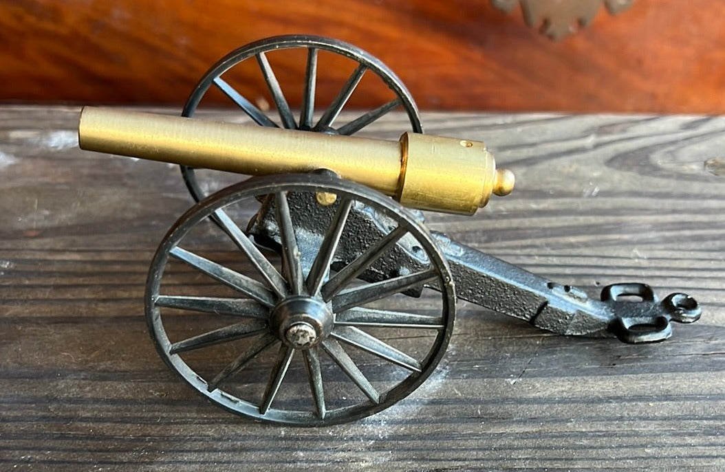 SMALL BRASS AND CAST IRON CANNON