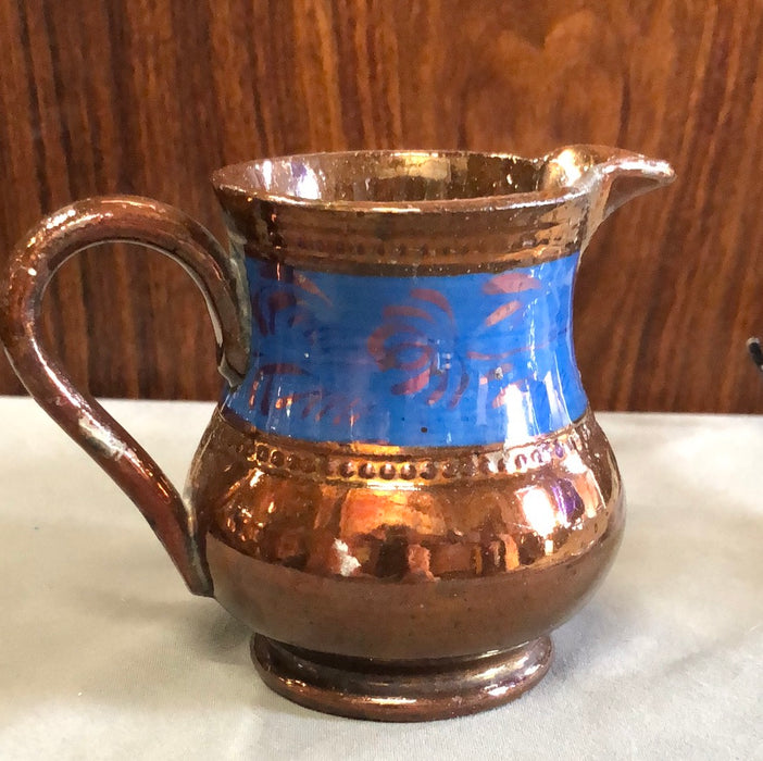 SMALL COPPER LUSTER PITCHER WITH FOLLIATE BLUE BAND