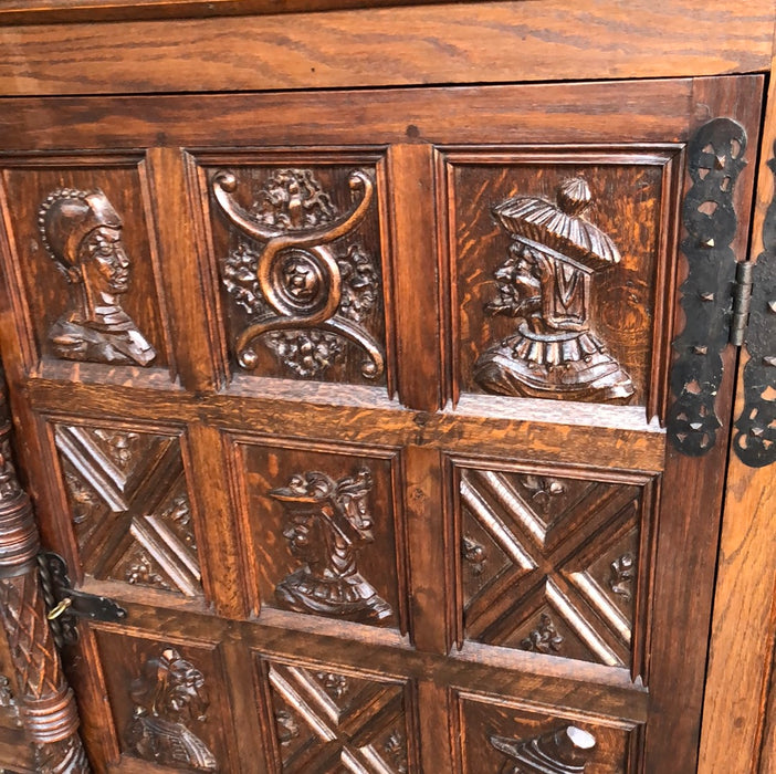 2 DOOR SHALLOW CARVED OAK GOTHIC CABINET with portraits