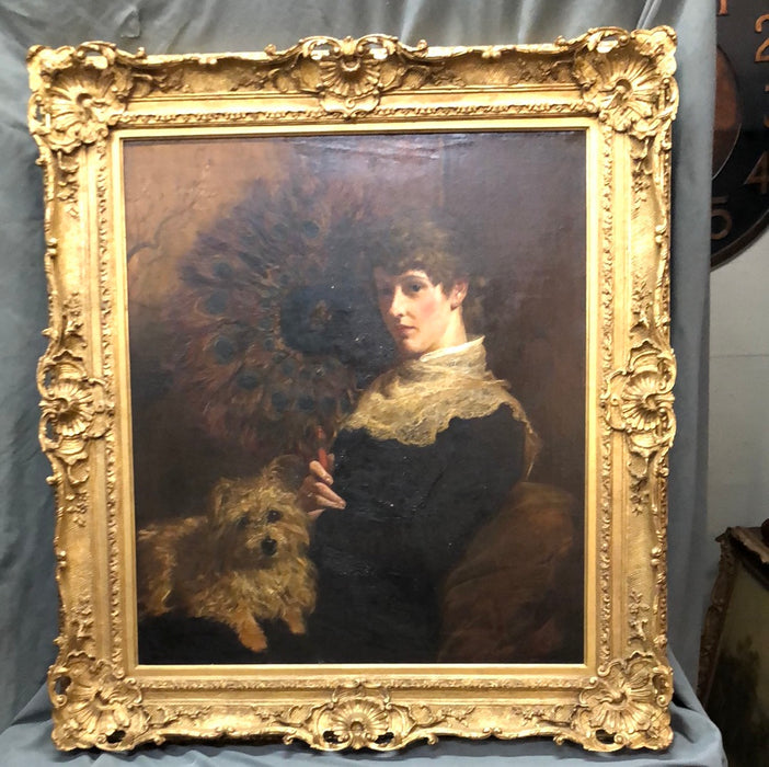 ORNATE GILT FRAMED OIL PAINTING OF A LADY AND HER DOG ON CANVAS