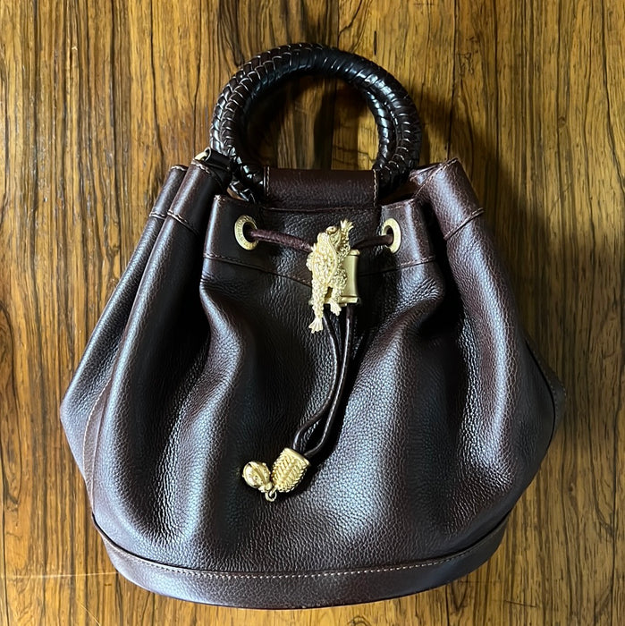 BROWN PURSE WITH SNAKE HANDLES AND FROG CINCH