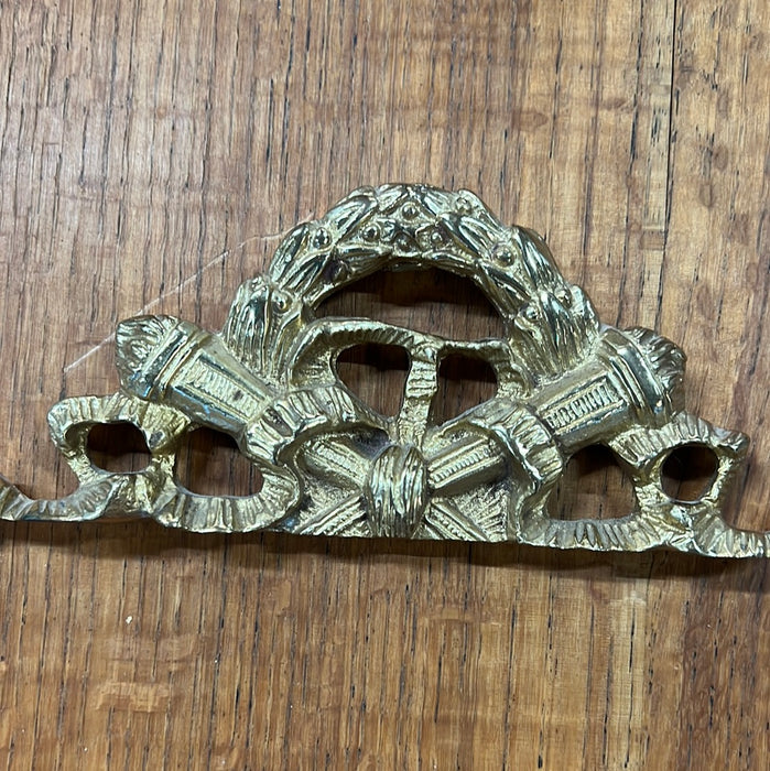 BRASS WALL HANGING WITH TORCHES AND WREATH