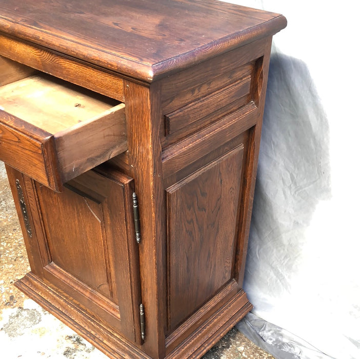 NARROW DARK OAK JAM CABINET WITH NOTCHED RETANGULAR PANEL