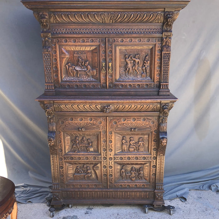 CARVED 2-PIECE OAK BRUEGHEL CABINET WITH FITTED INTERIOR