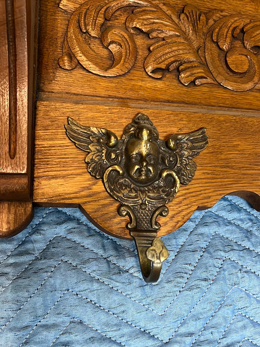 LIGHT OAK WALL SHELF WITH SHELLS AND CHERUB HOOKS