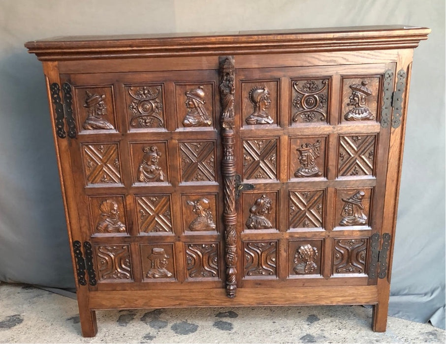 2 DOOR SHALLOW CARVED OAK GOTHIC CABINET with portraits