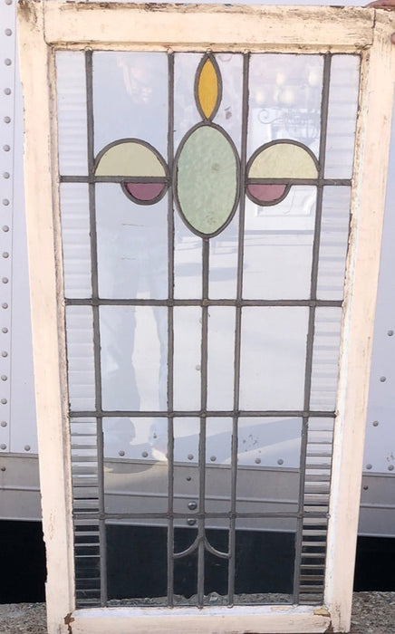 TALL STAINED GLASS WINDOW WITH GREEN OVAL AND YELLOW HALF OVALS