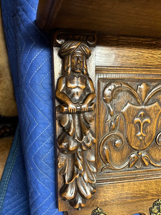 OAK CROSS AND FIGURAL CARVING WALL SHELF WITH HOOKS