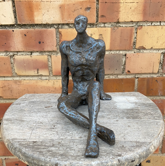 SMALL NOT OLD IRON FREEFORM SITTING MAN FIGURE