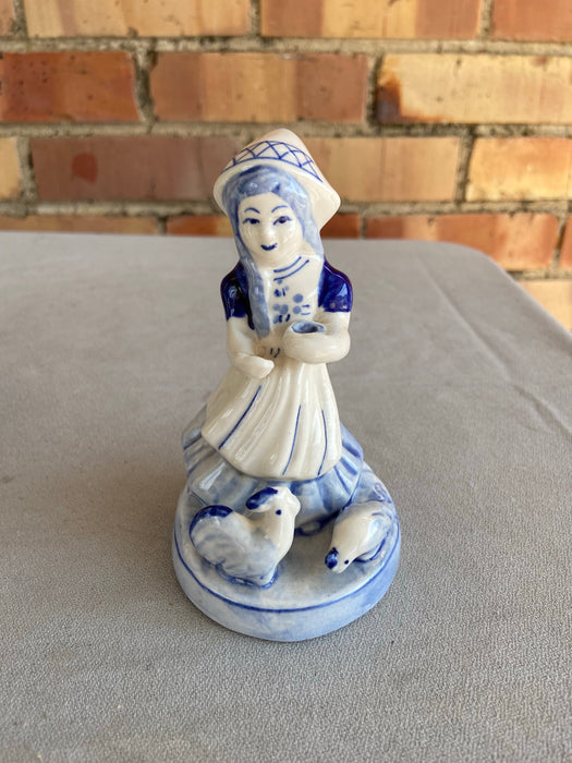 DELFT FIGURE OF GIRL FEEDING CHICKEN