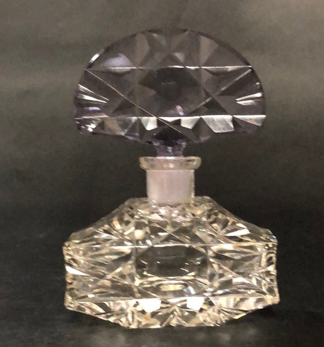 CLEAR PERFUME BOTTLE WITH PURPLE TOP