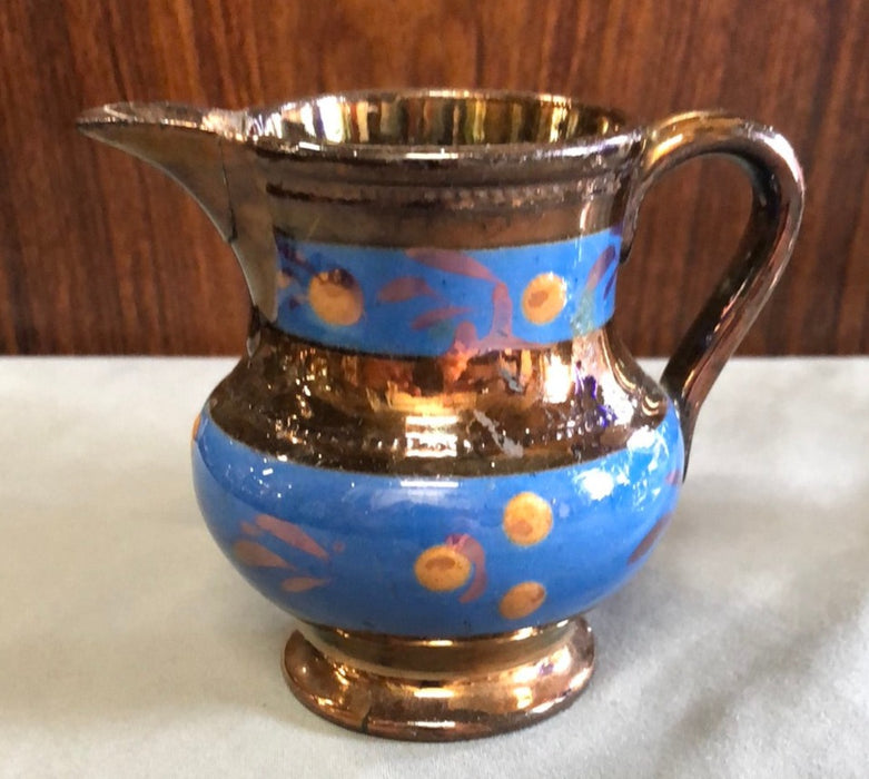 SMALL COPPER LUSTER PITCHER WITH 2 BLUE FLORAL BANDS