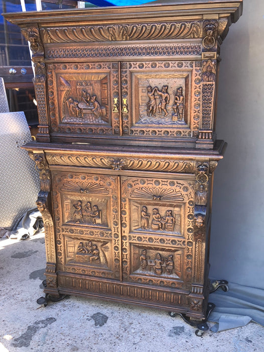 CARVED 2-PIECE OAK BRUEGHEL CABINET WITH FITTED INTERIOR