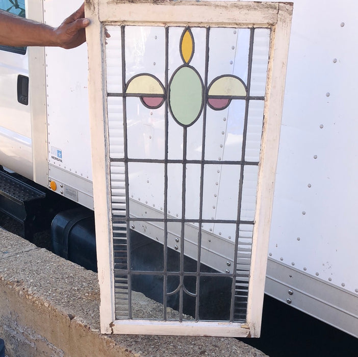 TALL STAINED GLASS WINDOW WITH GREEN OVAL AND YELLOW HALF OVALS