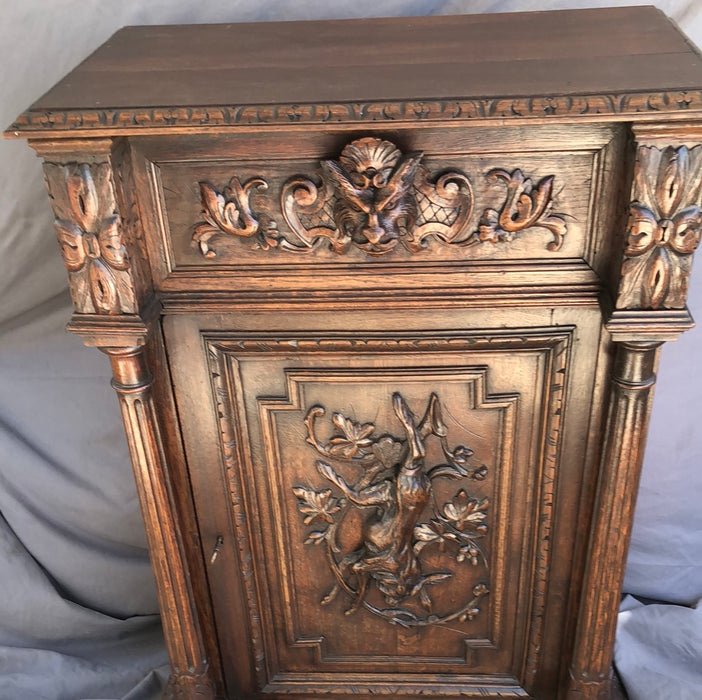 TALL OAK JAM CUPBOARD WITH RABBIT AND LION