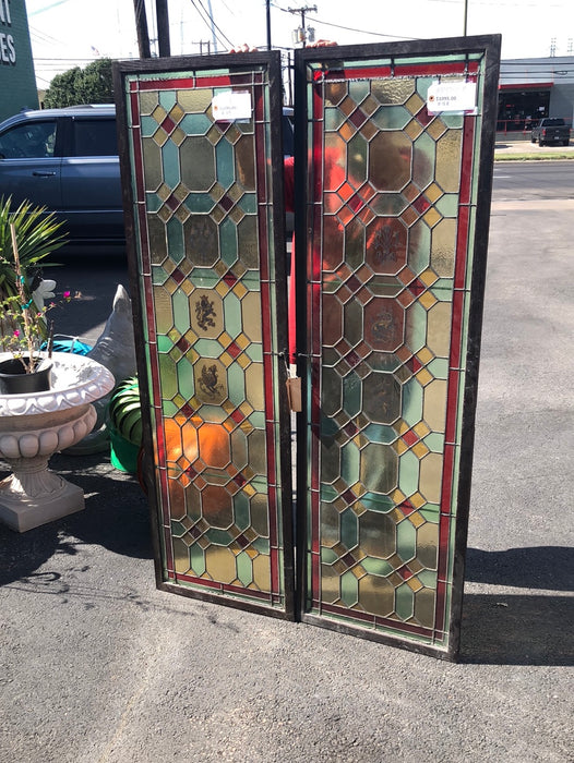 PAIR OF TALL NARROW STAINED GLASS WINDOWS HAND PAINTED WITH LIONS, DRAGONS, TORCHES