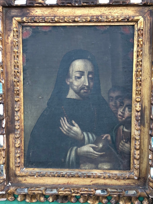 18TH CENTURY SAINT GIVING BREAD TO THE POOR OIL PAINTING ON CANVAS WITH GILT CARVED AND MIRRORED FRAME