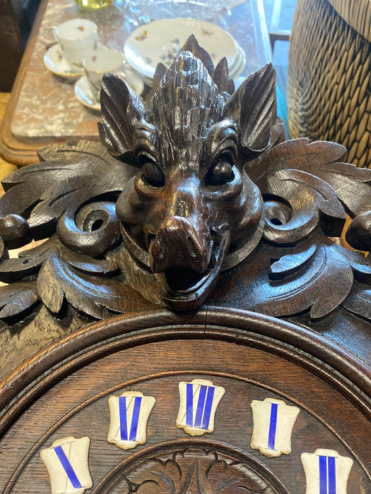 CARVED BOAR'S HEAD BLACK FOREST OAK CLOCK