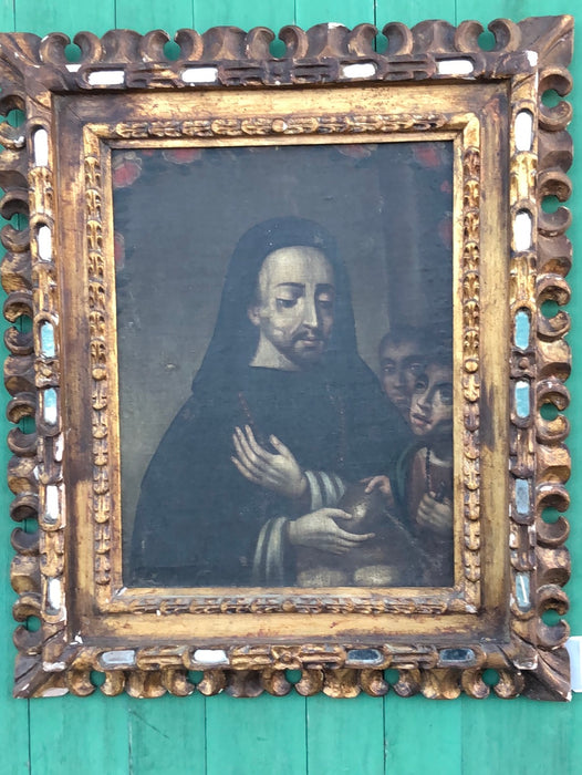 18TH CENTURY SAINT GIVING BREAD TO THE POOR OIL PAINTING ON CANVAS WITH GILT CARVED AND MIRRORED FRAME