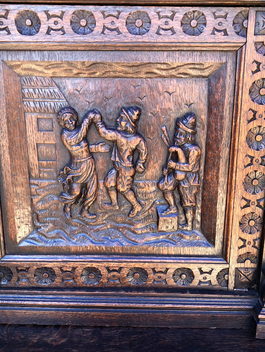 CARVED 2-PIECE OAK BRUEGHEL CABINET WITH FITTED INTERIOR