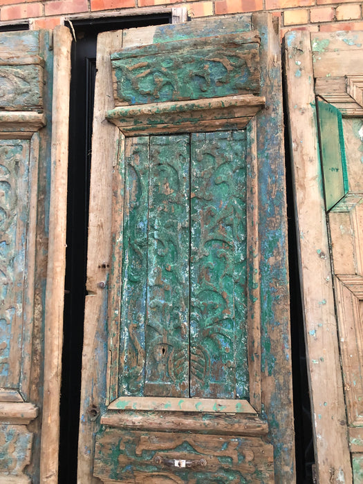 PAIR OF PRIMITIVE EGYPTIAN DISTRESSED GREEN WOODEN DOORS WITH INCISED CARVING