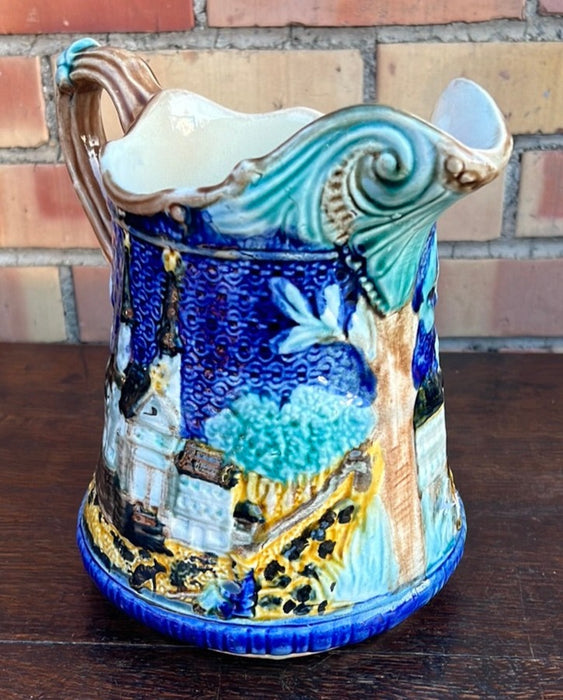 BLUE MAJOLICA PITCHER WITH CHURCH