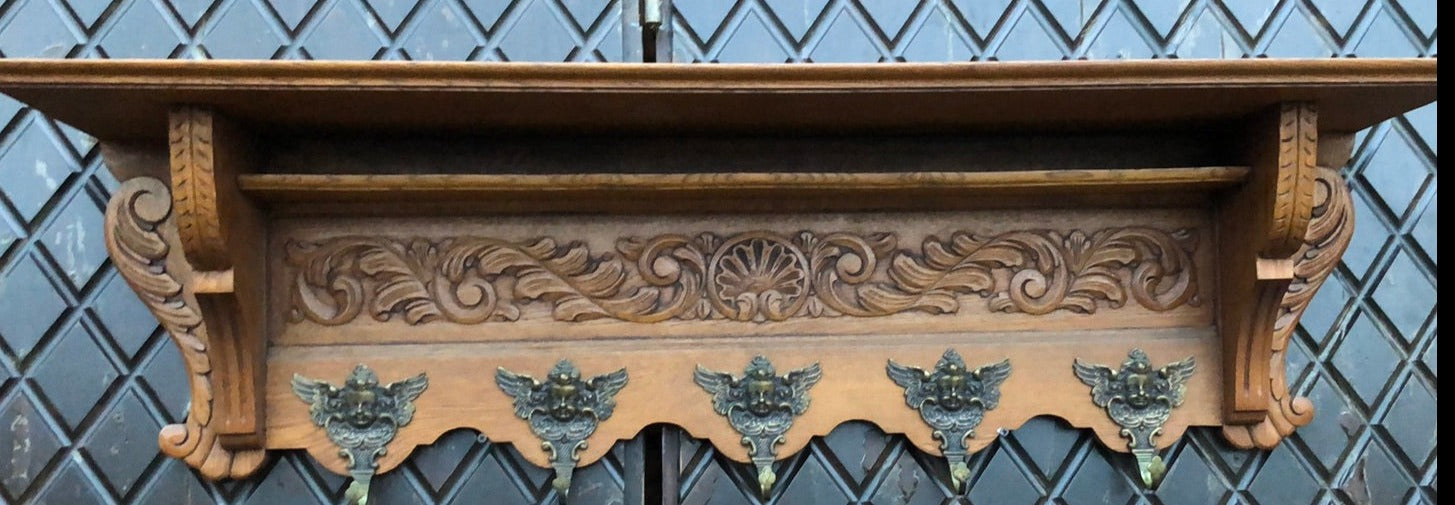 LIGHT OAK WALL SHELF WITH SHELLS AND CHERUB HOOKS