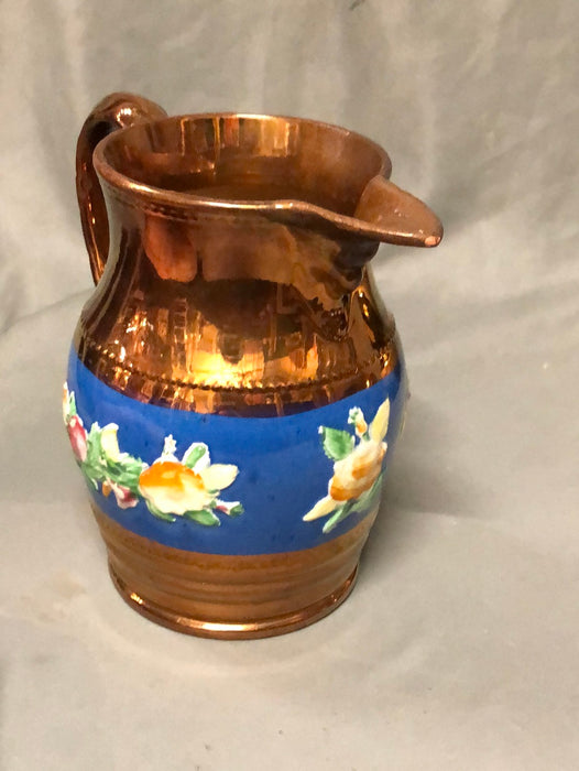 MEDIUM COPPER LUSTER PITCHER WITH BLUE BAND AND FLOWERS IN RELIEF