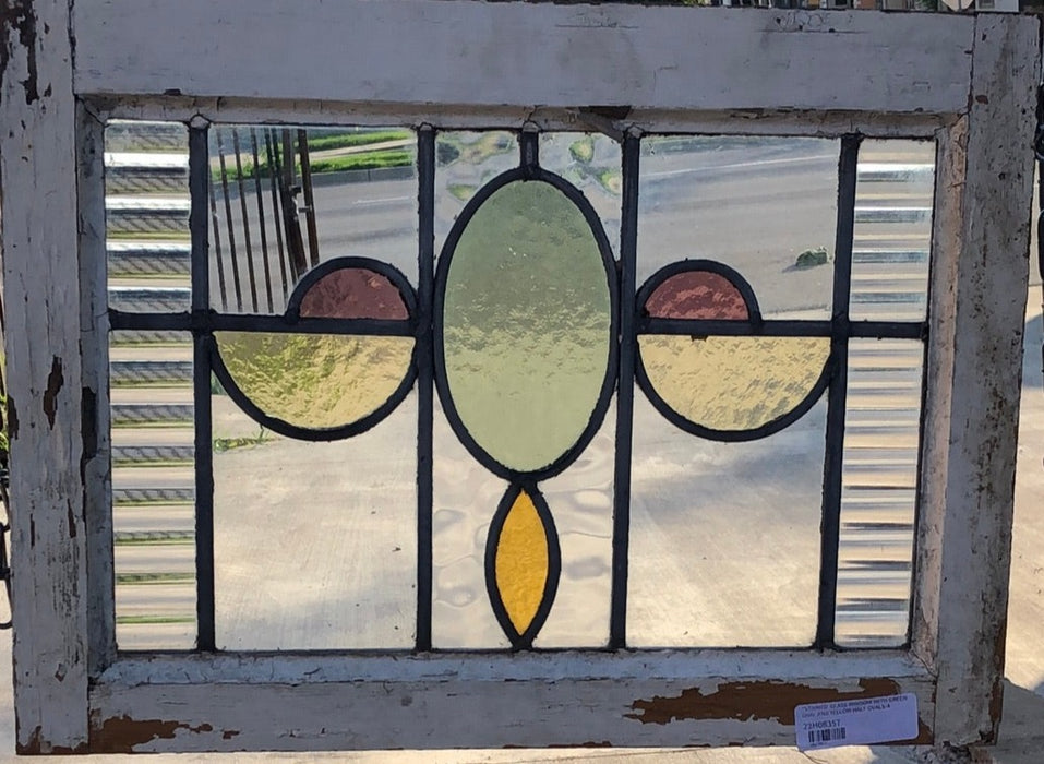 STAINED GLASS WINDOW WITH GREEN OVAL AND YELLOW HALF OVALS